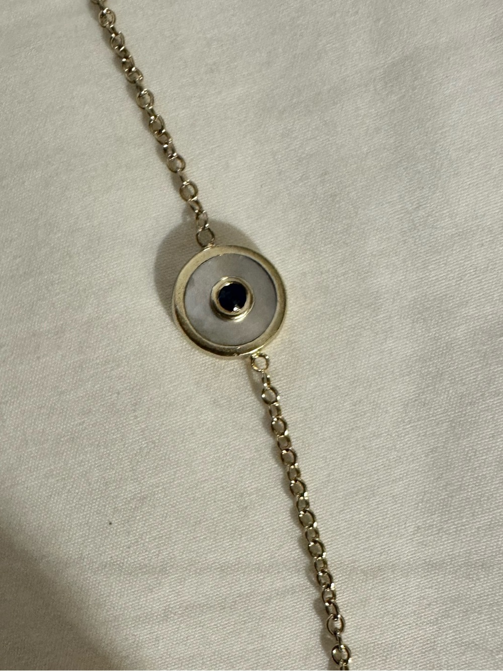 Retrouvai mini compass 14k gold and mother of pearl and sapphire bracelet